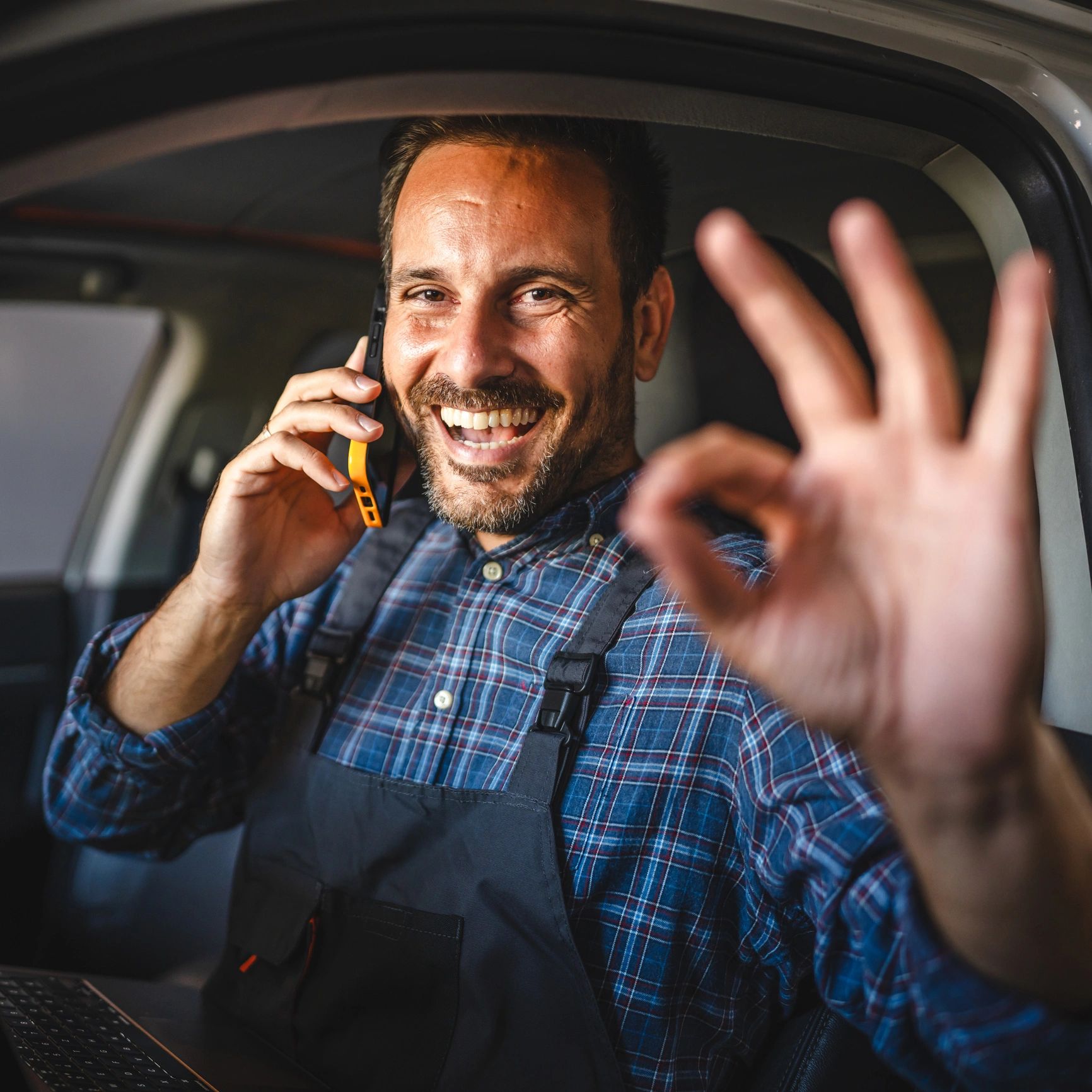 Smiling service professional giving an OK sign