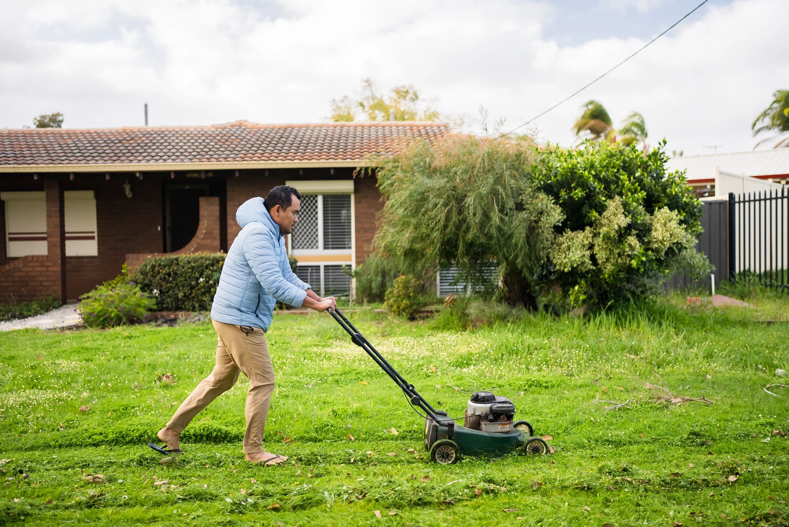 Homeowner outdoors with lawn mower