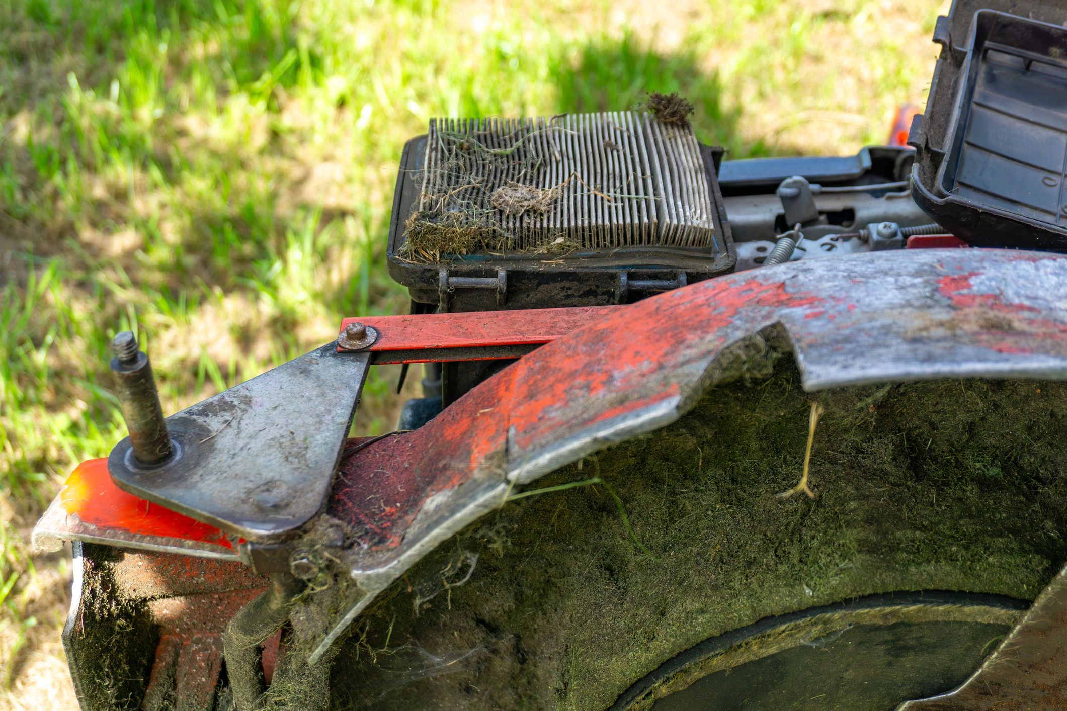 Close-up of a lawn mower air filter during maintenance