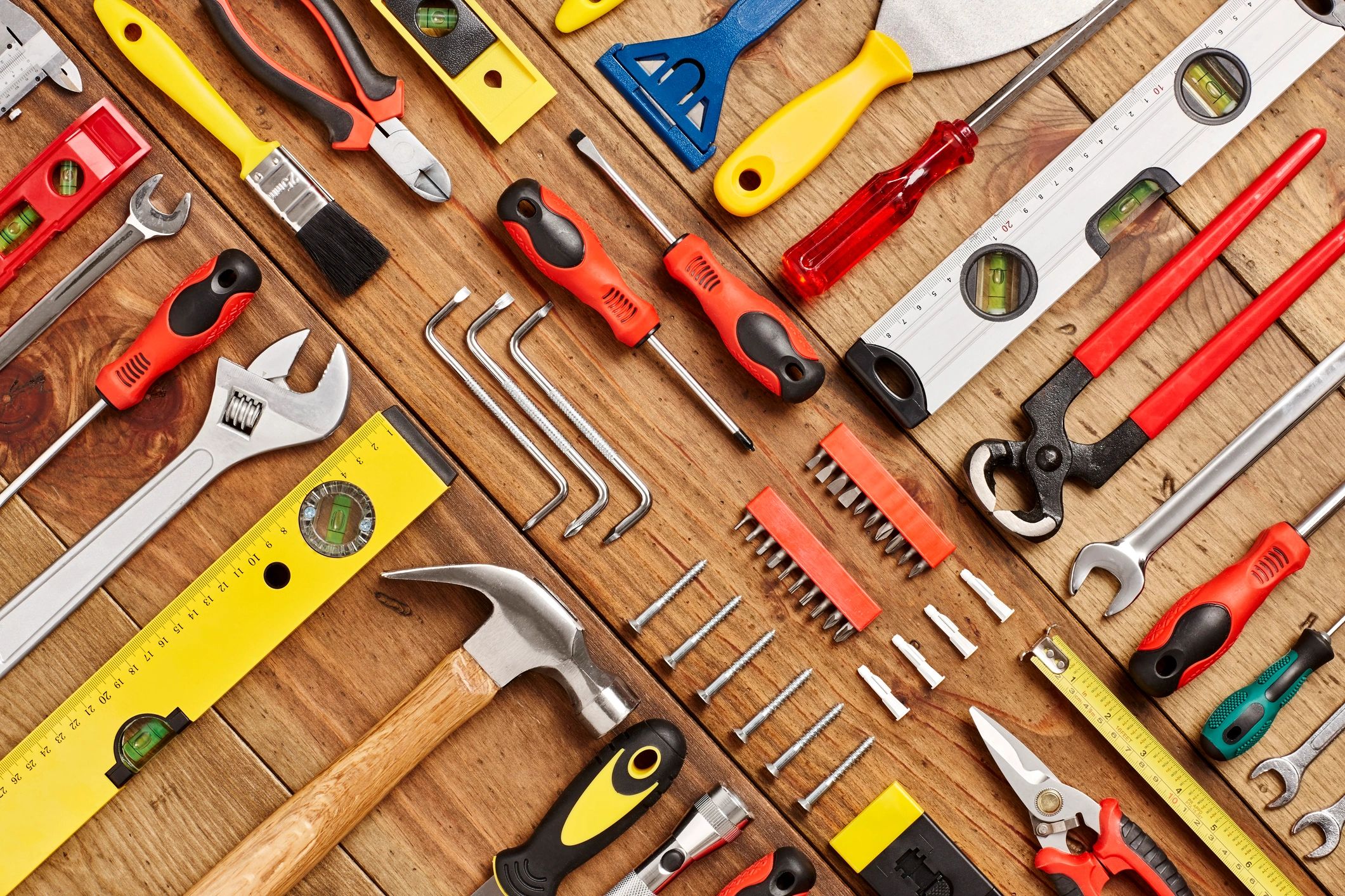 Hand tools arranged on a wooden surface